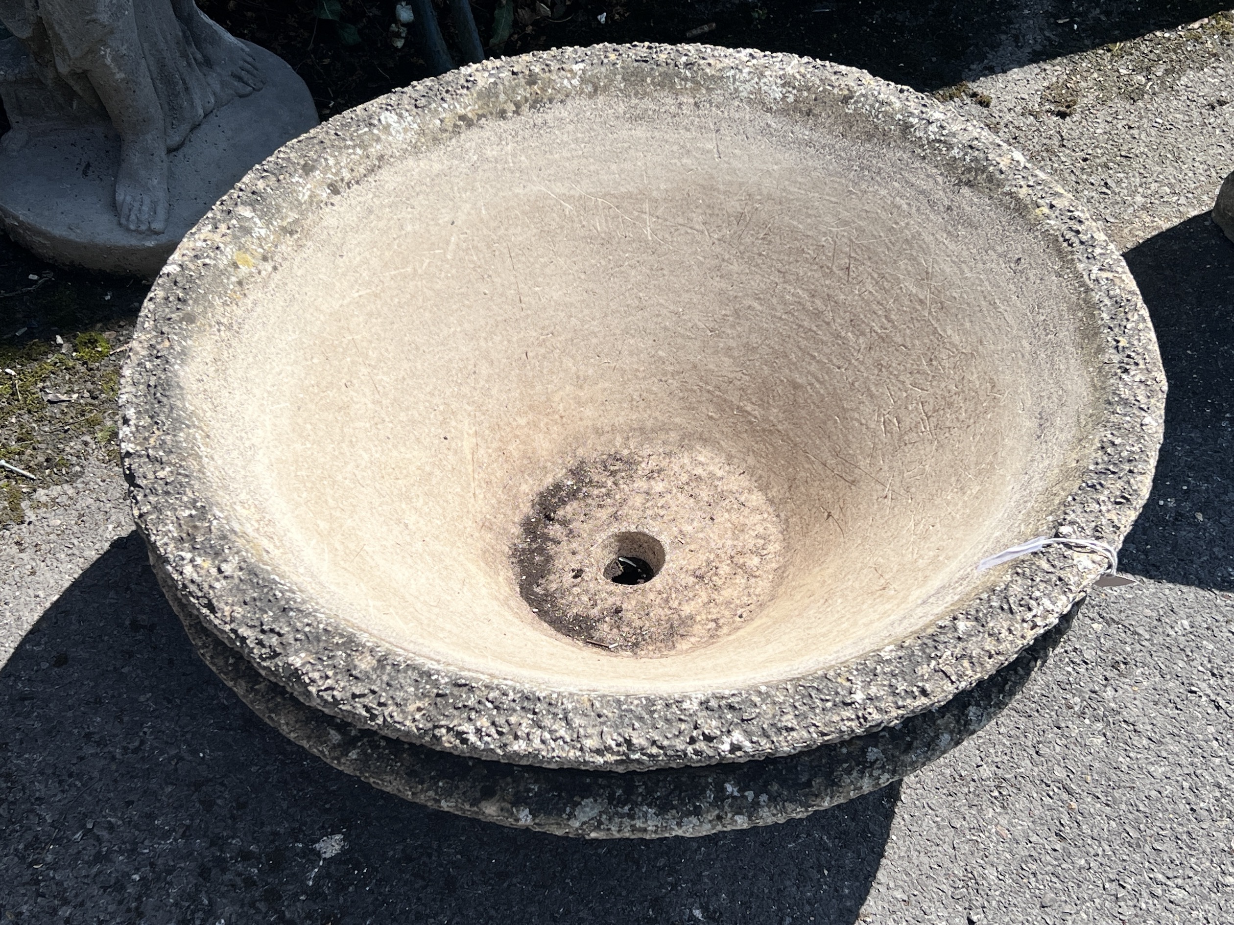 A pair of circular reconstituted stone conical planters, diameter 78cm, height 29cm